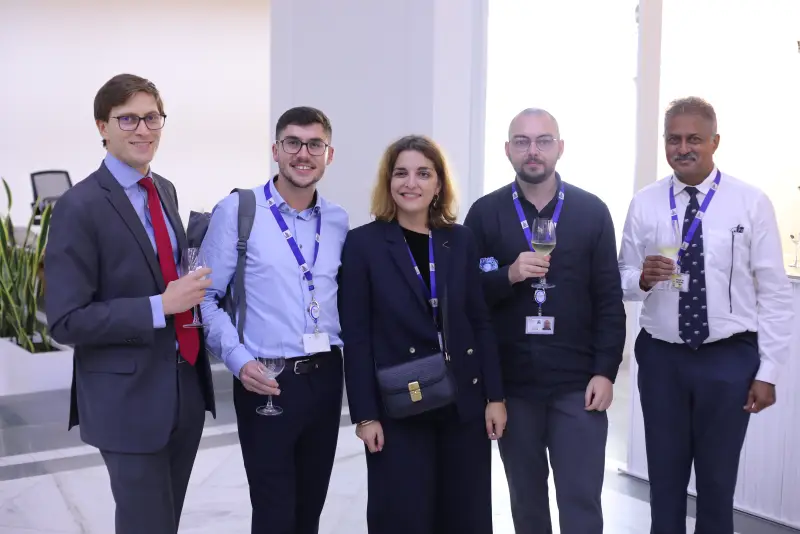 Delegates in conversation at a TASI gathering